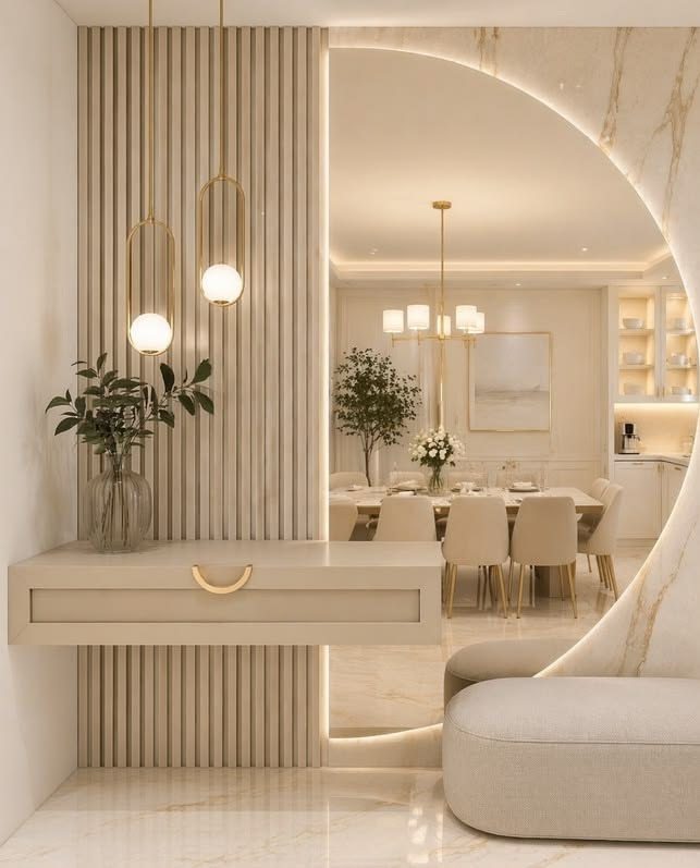 Entrance hall with fluted panelling, a floating console and a backlit marble arch opening to a dining room